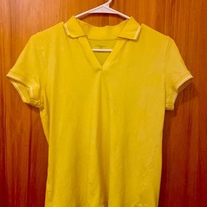 A yellow t-shirt with a collar. Very simple for a cute aesthetic. StJohnsBay :)